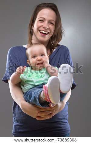 Young mother with her baby girl. Cute image with natural faces.