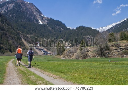 Family with senior parents hiking in the alps in Austria.