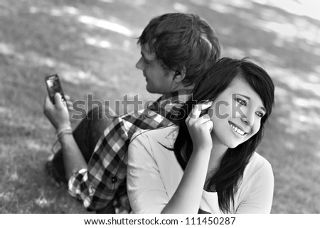 Young romantic couple enjoy sharing and listening to music