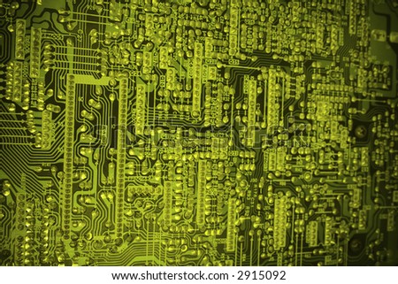 Toned computer circuit details in neon light