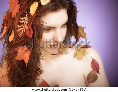 Art portrait of a young woman stylized to forest fairy. Natural beauty art.