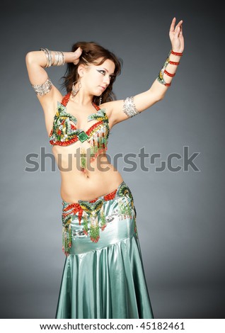 Attractive belly-dancer woman in stylized easter clothing and make up