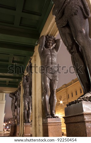 Night view of Granite Atlases Guarding the Hermitage Museum, St. Petersburg, Russia