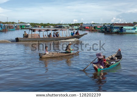 SIEM REAP, CAMBODIA : Cambodian people live beside Tonle Sap Lake in Siem Reap, Cambodia on September 25, 2012. This is the largest freshwater lake in SE Asia peaking. Annual flooding of the village.