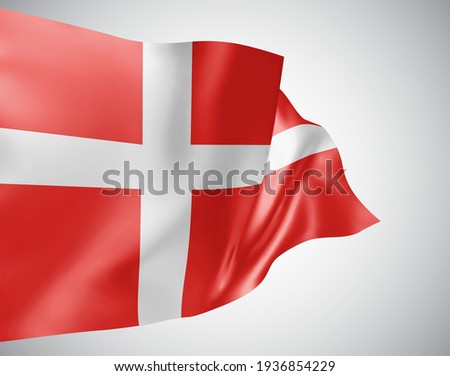 Denmark, vector flag with waves and bends waving in the wind on a white background.