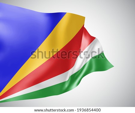 Seychelles, vector flag with waves and bends waving in the wind on a white background.