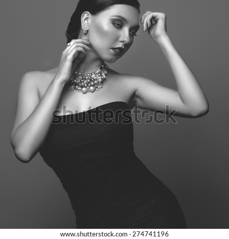 pearl skin, black dress, studio fashion portrait. black and white