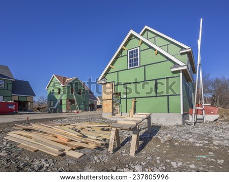 A single family home under construction in a housing development complex.