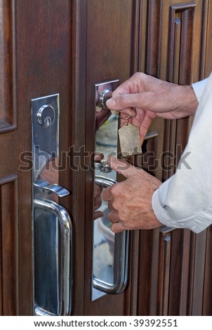 Man opening front door to house