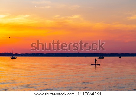 Similar – Image, Stock Photo Paddling on the Chiemsee