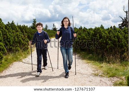 Nordic walking - young people exercising outdoor