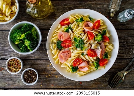 Similar – Image, Stock Photo Preparing a ham salad with rice to take away. The containers used are compostable.