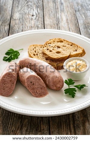 Similar – Image, Stock Photo German white sausage table top view. Bavarian veal sausage section