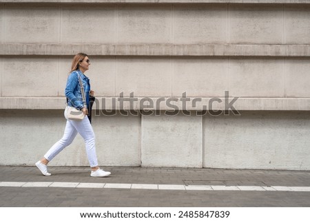 Similar – Image, Stock Photo Slim woman walking on beach