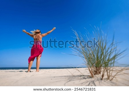 Similar – Image, Stock Photo Woman with pink pareo on sandy beach