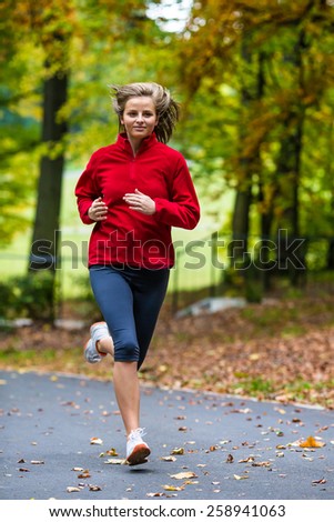 Healthy lifestyle - woman running in park