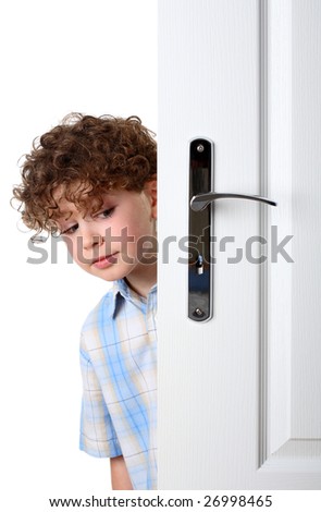 Boy Peeking Behind The Door Looking For Something Stock Photo 26998465 ...