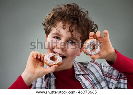 Boy eating sweet donut