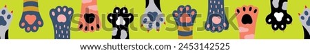 Vector seamless horizontal border with colored cat paws. Can be used for wallpaper, pattern fills, web page background,textile, postcards.