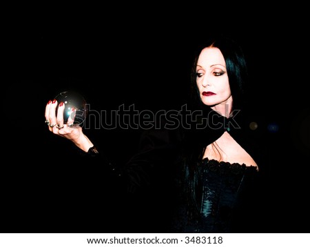 Crystal ball held in the hands of a fortune teller.