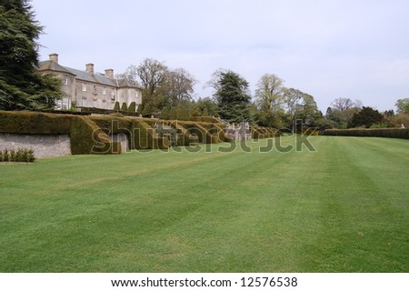 old country house with ornamental hedges