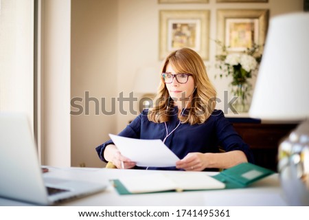 Similar – Image, Stock Photo Attractive woman with headphones showing the tattoos on her hands on a pink background