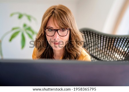 Similar – Foto Bild Frau lächelt hinter Kaffeetasse hervor