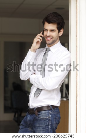 Young businessman holding handy in his hand. Small business.