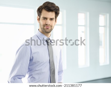 Executive young businessman standing at office. Business people.