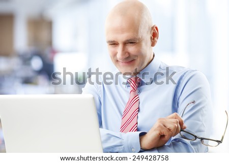 Casual sales man sitting in front of computer while sitting at office. Business people.