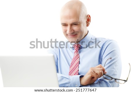 Executive senior financier officer sitting in front of computer and analyzing financial situation.