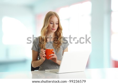 Young woman browsing on computer in the office