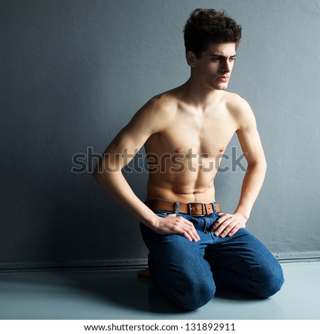 Portrait of a well built shirtless muscular male model