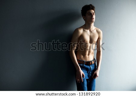 emotional Portrait of a well built shirtless muscular male model