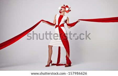 emotional portrait of fashion woman in exclusive dress posing in studio
