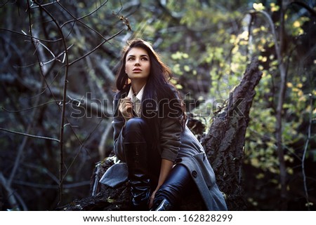 Fashion portrait of woman in mystery forest
