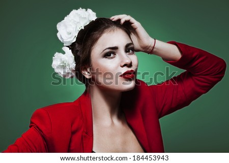 close up portrait of fashion model with bright makeup and flowers in hair
