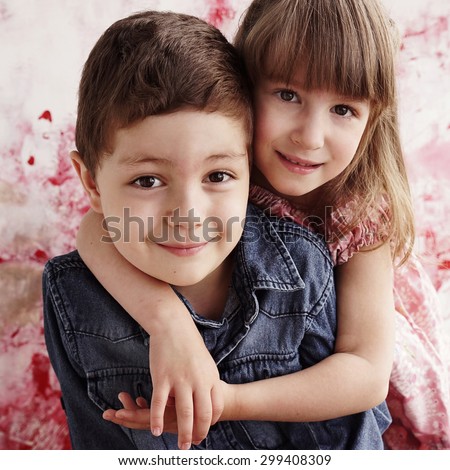 cute brother and sister hugging each other