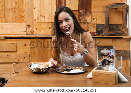 https://image.shutterstock.com/display_pic_with_logo/816283/505148251/stock-photo-beautiful-woman-eating-traditional-balkan-dish-in-restaurant-505148251.jpg