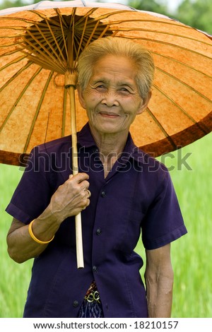 old Asian woman with parasol