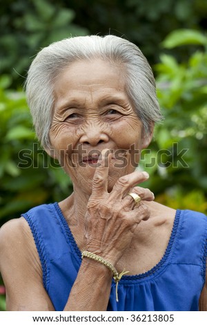 Portrait old Asian woman with gestures