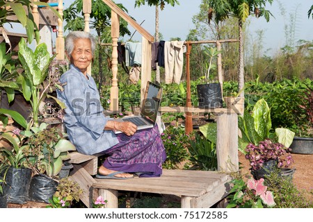 old asian woman with laptop