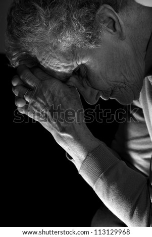 meditation of old woman by the candle