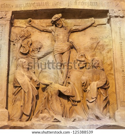 VIENNA - JANUARY 15: Relief of Crucifixion as detail of old tomb on the west facade of st. Stephen cathedral on January 15, 2013 in Vienna.