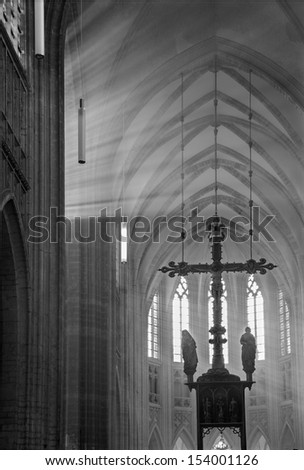 LEUVEN - SEPTEMBER 3: Presbytery and cross of st. Peters gothic cathedral and rays of morning sun in Sepetember 3, 2013 in Leuven, Belgium.