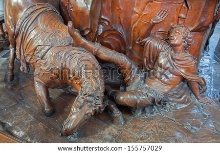 LEUVEN, BELGIUM - SEPTEMBER 3: Carved  sculpture of Conversion of St. Paul in St. Peters cathedral on September 3, 2013 in Antwerp, Belgium