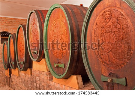 BRATISLAVA, SLOVAKIA - JANUARY 30, 2014: Carved casks in wine cellar of great Slovak producer.