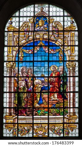 BRUSSELS, BELGIUM - JUNE 21, 2012: Jesus gives the keys of kingdom of heaven. Windowpane from Saint John the Baptist church.
