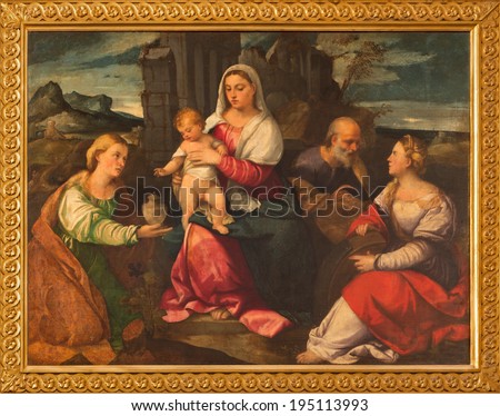 VENICE, ITALY - MARCH 13, 2014: The Holy Family with st. Mary Magdalen and st. Katherine by Bonifacio de Pitati (1487 - 1553)  in church Chiesa di San Stefano.