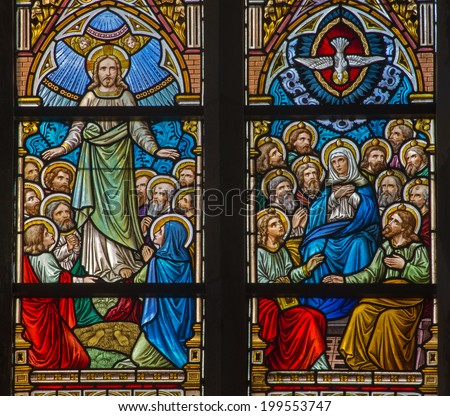 BRUGGE, BELGIUM - JUNE 12, 2014: The Ascension of Jesus and Pentecost scene on the windwopane in st. Jacobs church (Jakobskerk).